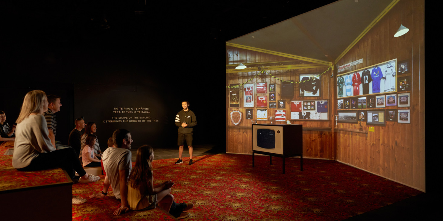 Group sitting looking at vintage tv lounge room