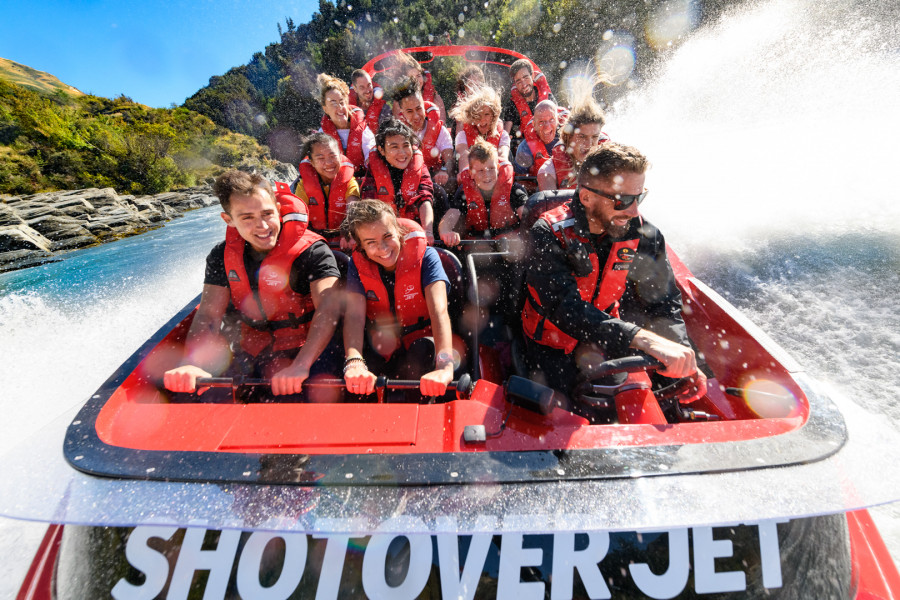 Passengers enjoying the thrill of doing a spin in the Shotover Jet