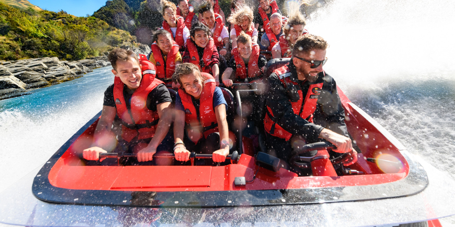 Passengers enjoying the thrill of doing a spin in the Shotover Jet
